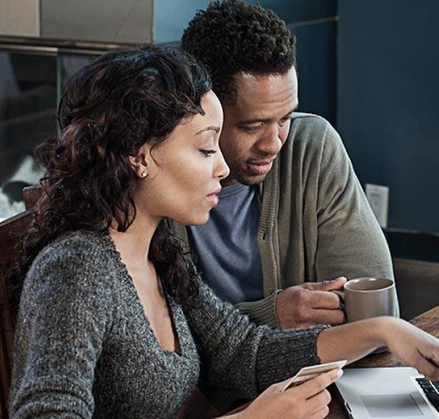 Man and woman looking at computer